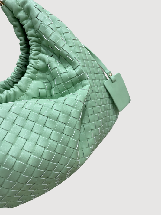 Borsa in ecopelle verde intrecciata con manici