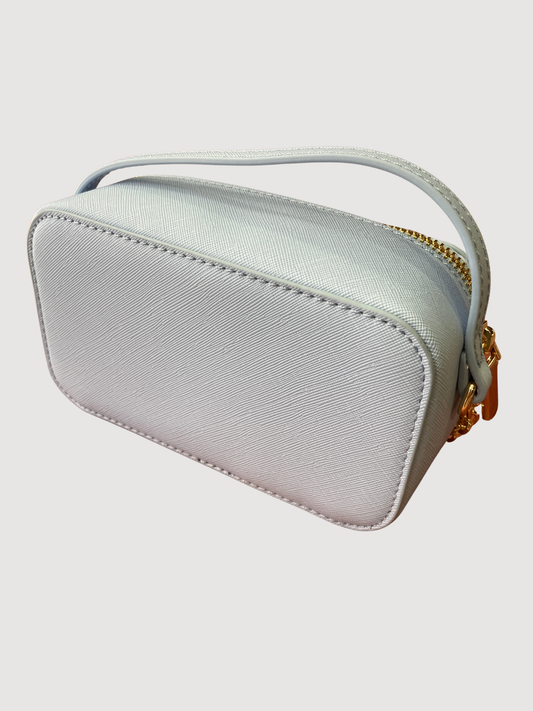 Borsa in ecopelle azzurra a mano con tracolla oro